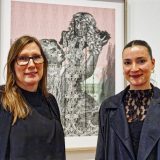 Geelong Gallery curatorial assistant director Lisa Sullivan and assistant curator Lana De Lorenzi with 'Served bold' from the After Image exhibition. (Ivan Kemp)